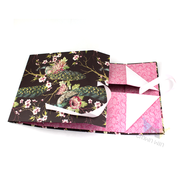 Factory production area with stacks of finished boxes and workers assembling packaging, illustrating the challenges of producing both disposable and cartridge packaging formats.