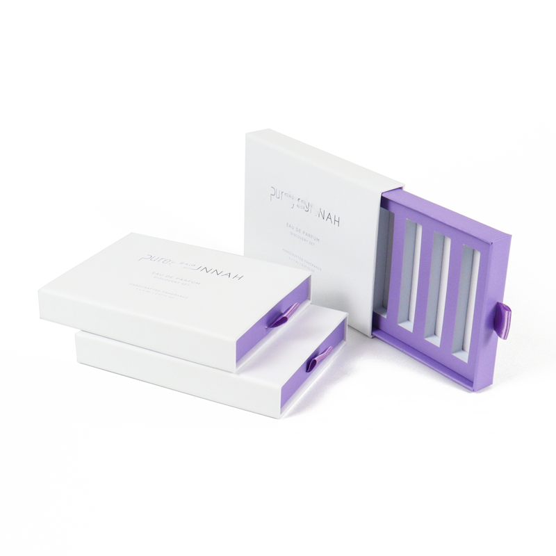 White and purple drawer-style boxes with transparent side panels and magnetic closure, showcasing premium design and controlled access.