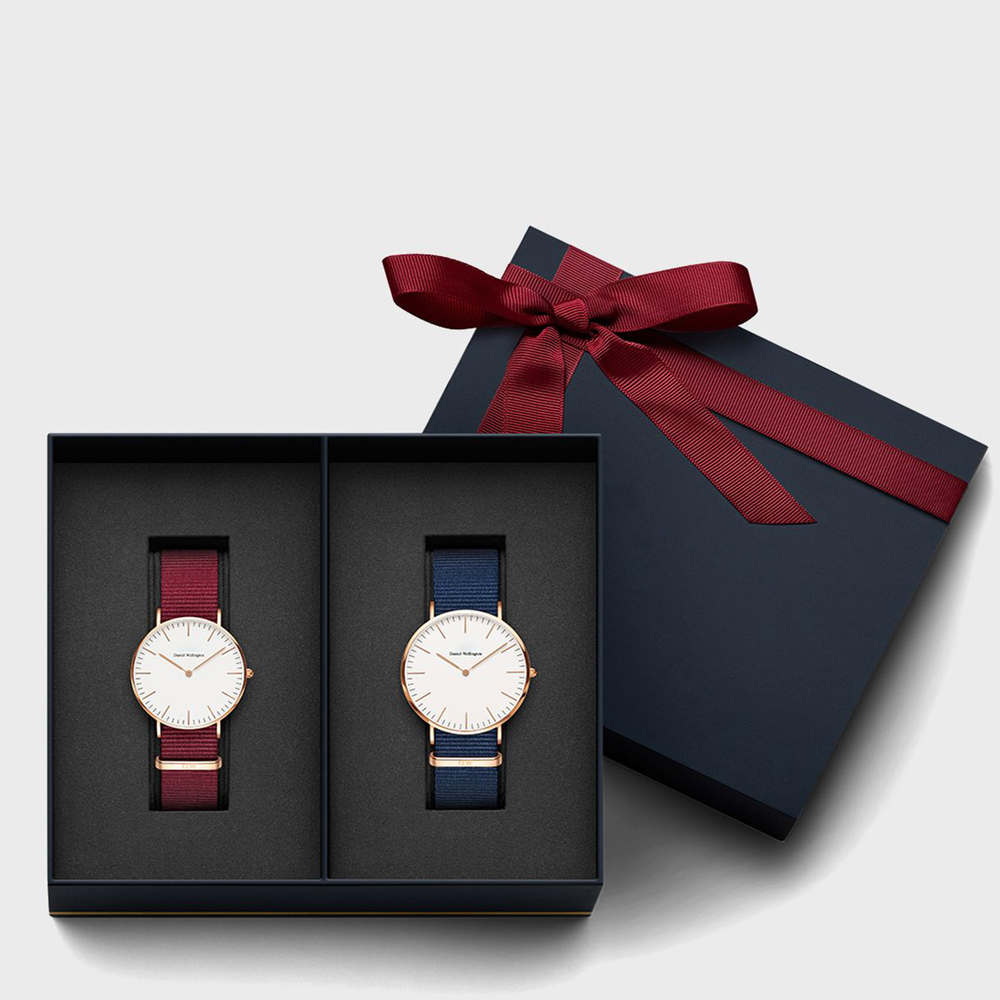 Elegant dual-watch gift box with custom foam inserts and red ribbon—highlighting how complex structures impact MOQ and cost in custom watch packaging.