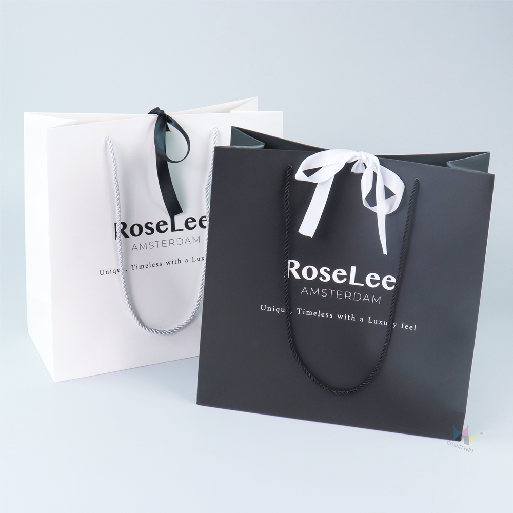 High-End Black and White Paper Bags with Satin Ribbons – Luxury Packaging for Premium Fashion Brands