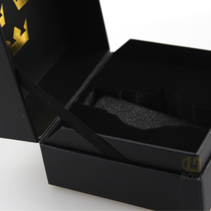 Open black rigid box with custom-molded EVA foam insert and magnetic closure, showcasing secure fit and sleek interior design.