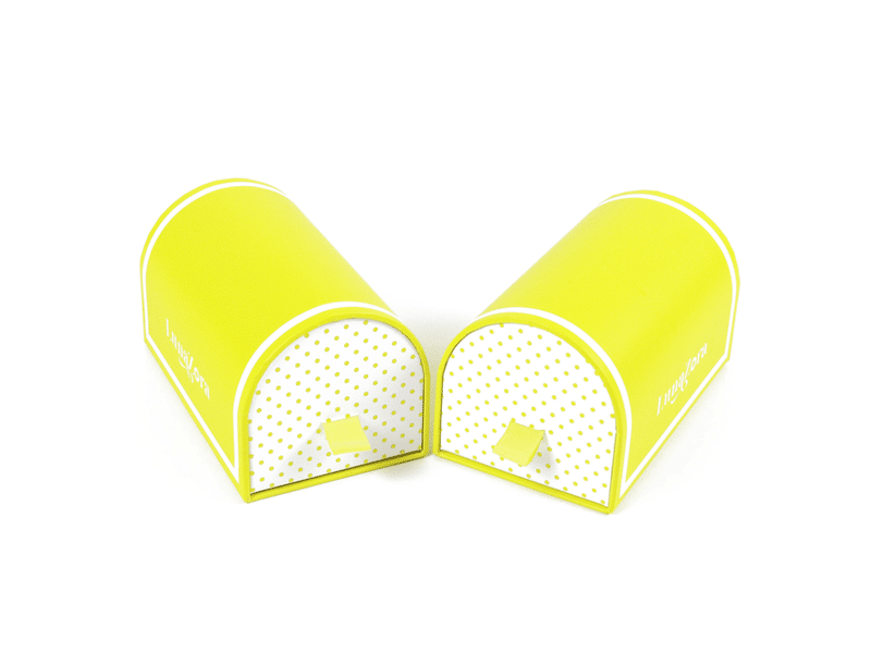Custom yellow arch-shaped rigid gift boxes with patterned front panels and ribbon pull tabs, designed for cosmetics, jewelry and premium gift packaging.