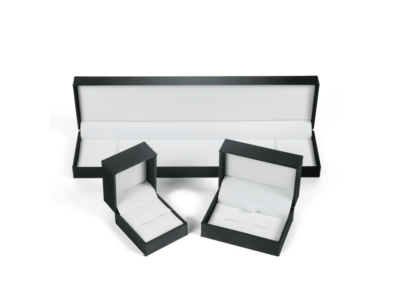 Custom black jewelry packaging box set with white velvet inserts, including long necklace or bracelet box and small ring and earring presentation boxes.