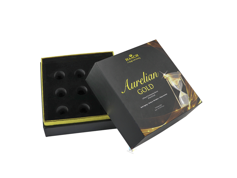 Custom black two-piece rigid cosmetic packaging box with gold foil printing and a six-hole protective foam insert for ampoules, serum bottles and beauty products.