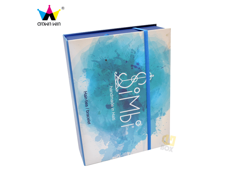 Custom blue watercolor-printed book-style rigid gift box with elastic band closure, designed for hair accessories, jewelry and premium retail packaging.