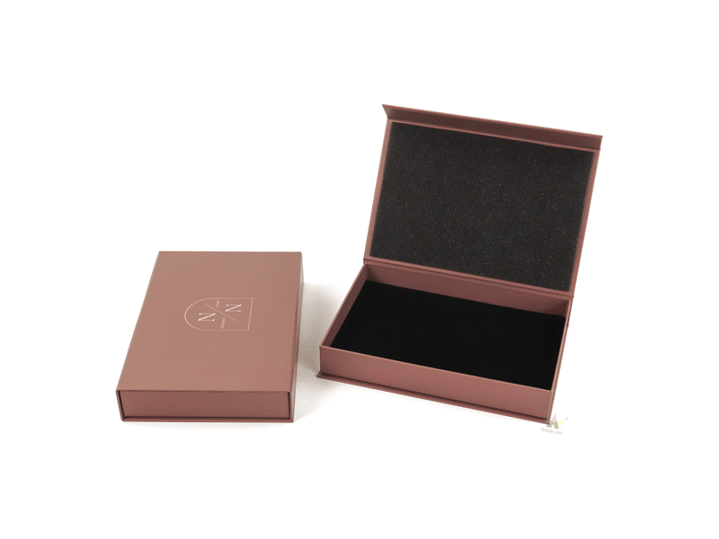 High-quality rigid magnetic gift box in matte mauve pink, features a flip-top lid, custom screen-printed brand logo, and protective black velvet foam lining.