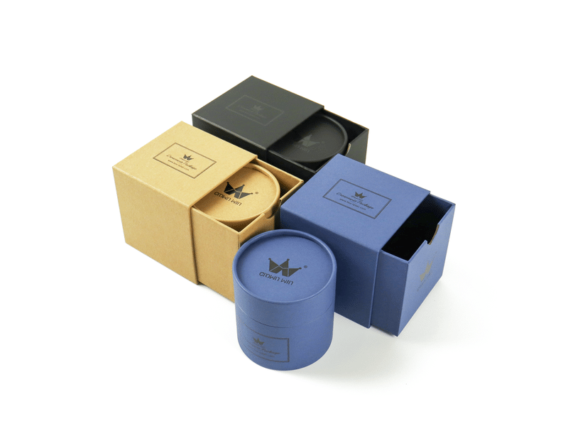 Custom gold, black and blue slide-out drawer gift boxes with matching cylindrical paper tube, designed for jewelry, cosmetics and premium product packaging.