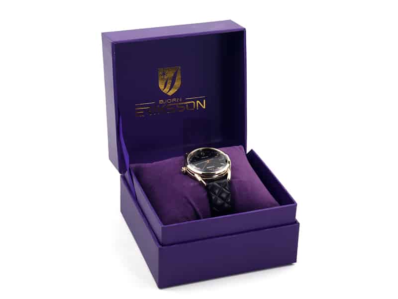 Luxury purple rigid watch gift box with soft velvet cushion insert, featuring premium gold foil logo and elegant wristwatch presentation for high-end brands.