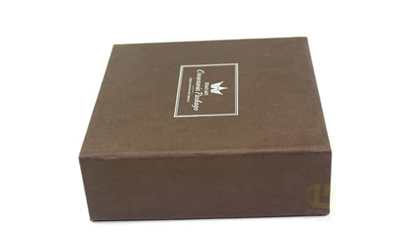 Brown luxury rigid watch gift box with custom logo on top, premium minimalist packaging designed for high-end wristwatch presentation and branding.