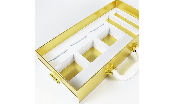 Luxury rectangular rigid packaging box with yellow interior and white EVA insert compartments, designed for premium watch set display and organization.