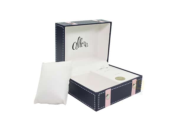 Luxury rigid jewelry gift box with white interior and soft pillow insert, featuring premium custom packaging design for watches or accessories.