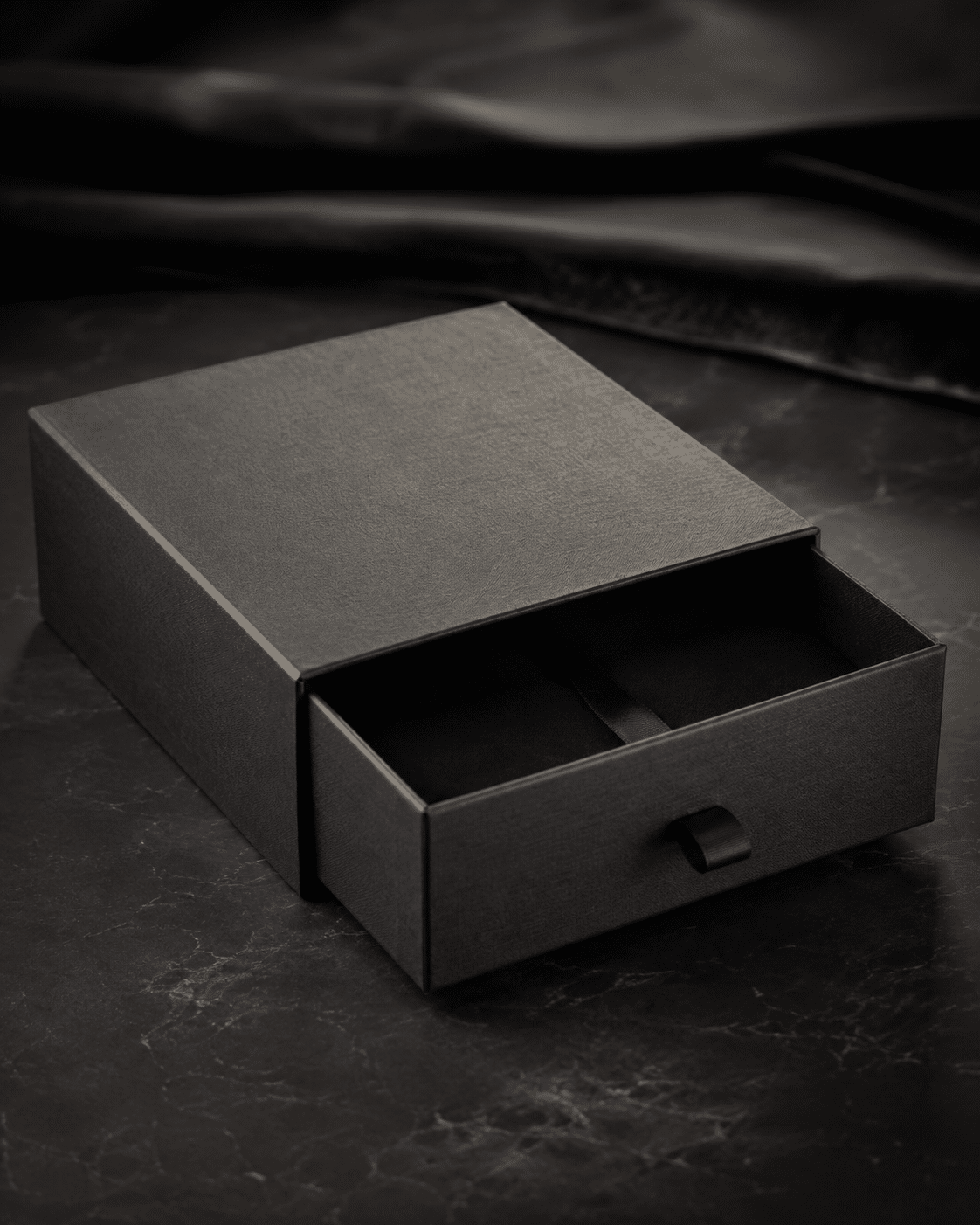 Black custom drawer box with ribbon pull tab for luxury product and gift packaging