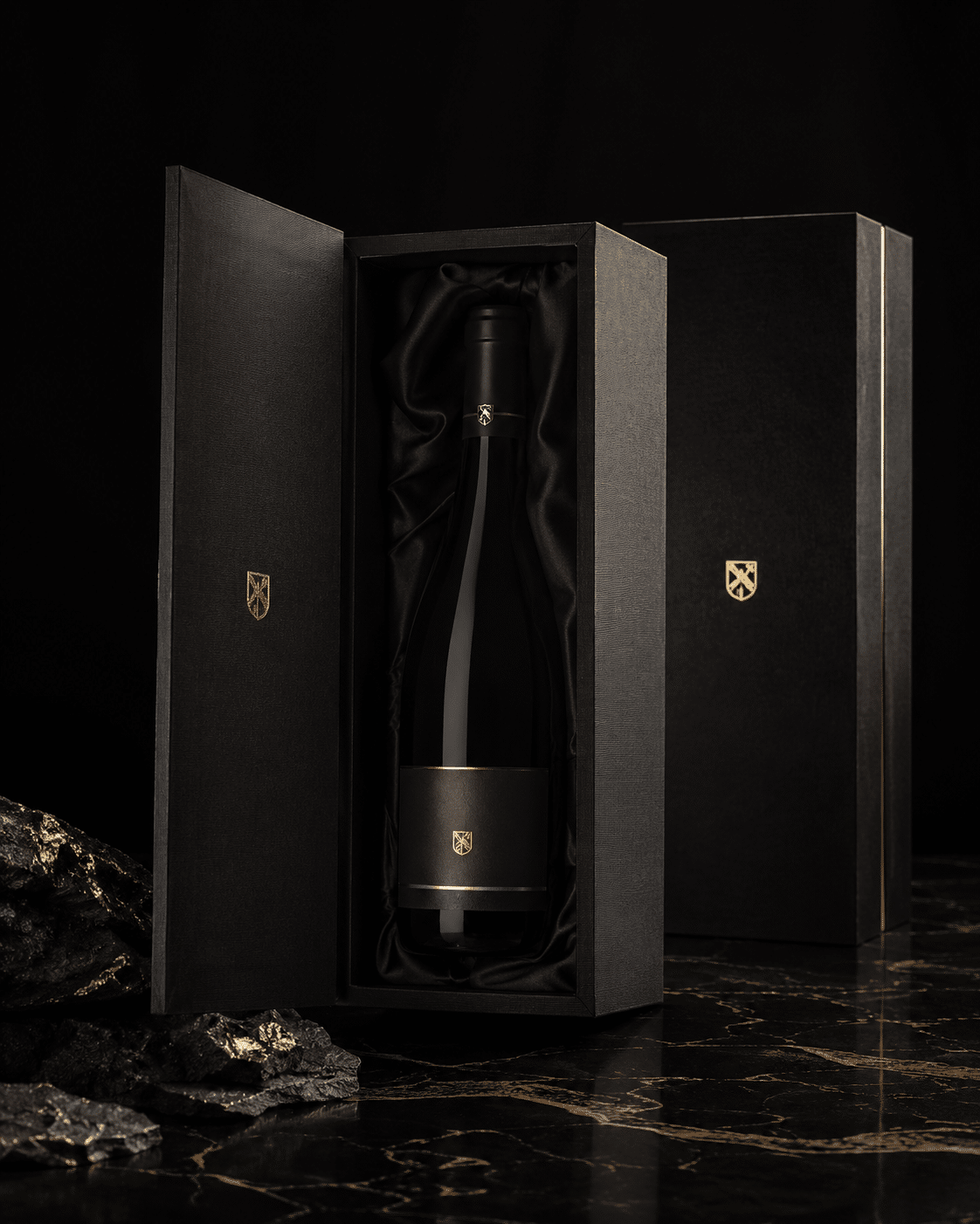Luxury black wine presentation box with hinged doors, gold foil logo and soft black satin lining for a single bottle