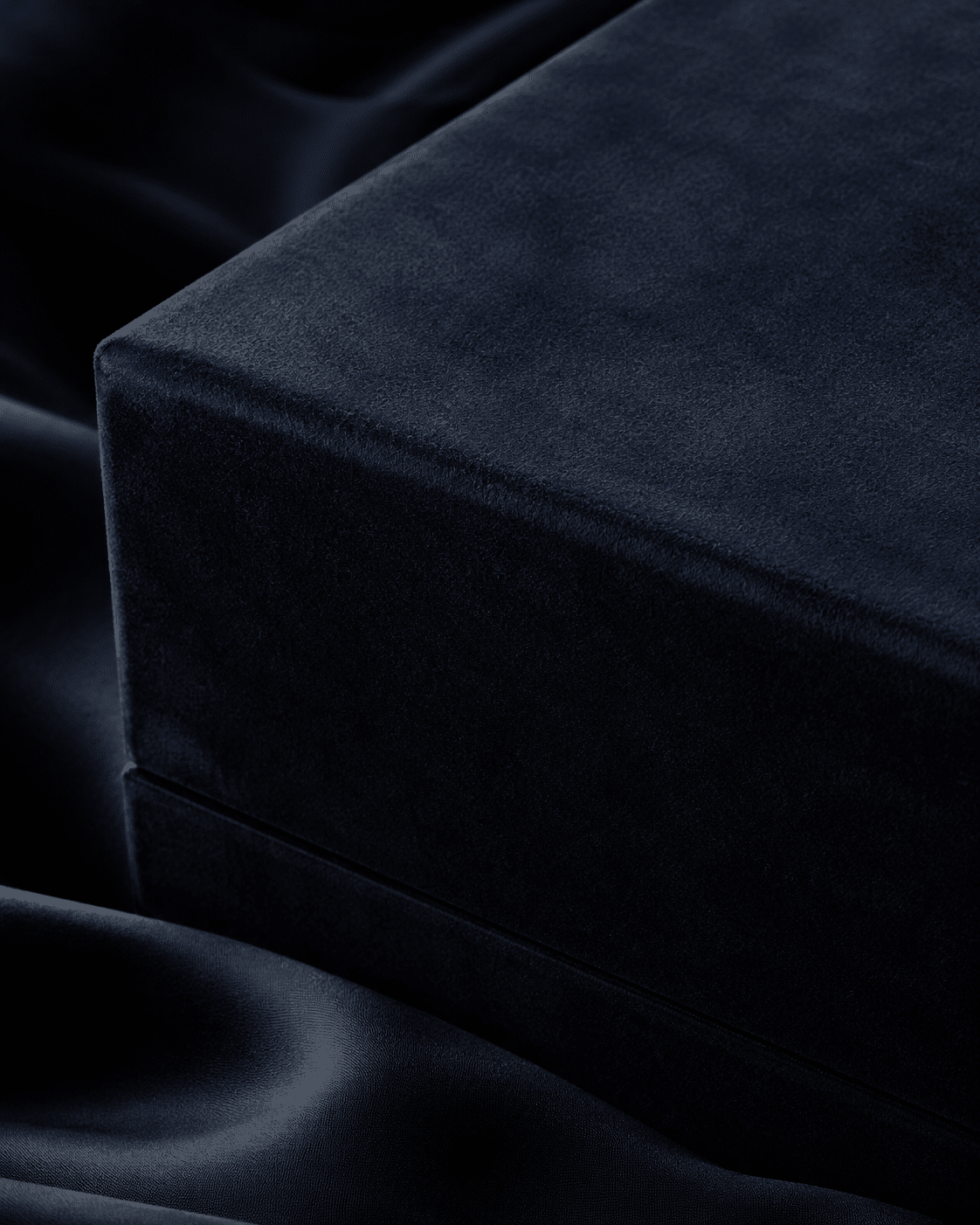 Close-up of a premium navy rigid box covered with soft velvet fabric for an elegant tactile packaging finish