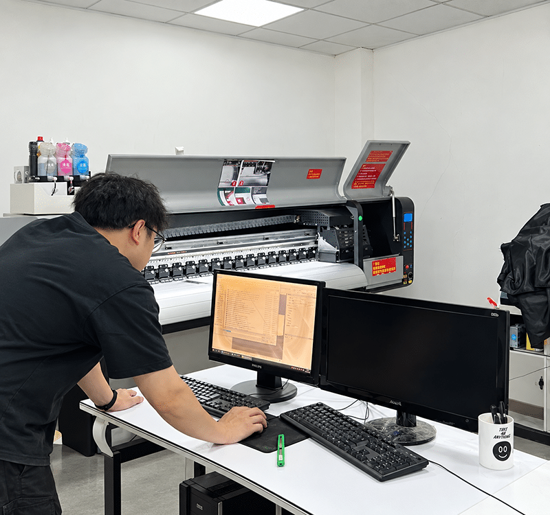 Crown Win operator using digital printing equipment to prepare printed packaging materials