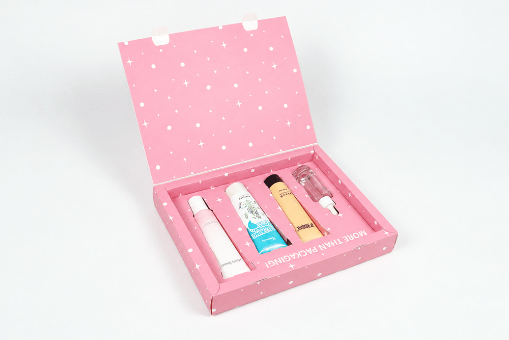 Open pink custom cosmetics box with a fitted insert holding skincare products