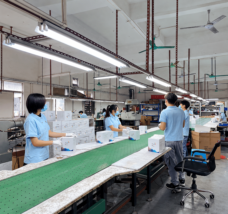 Crown Win quality control staff inspecting box structure, alignment and finish on the packaging production line
